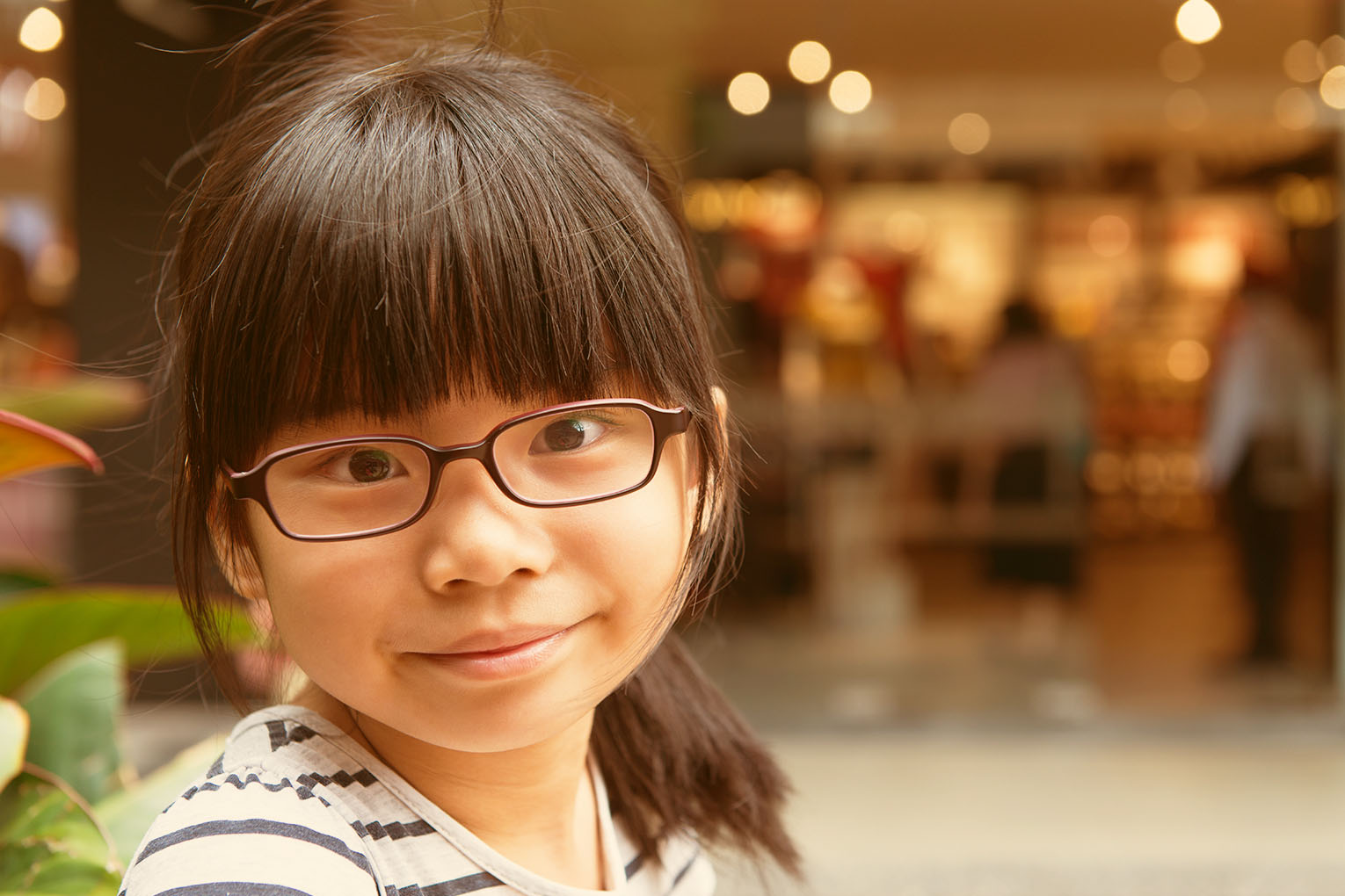 Portrait of anxious young woman sitting at desk in doctors office and waiting for doctor